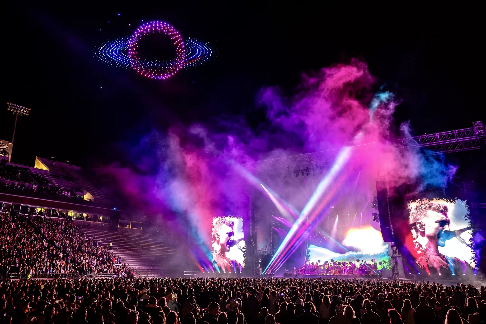 Image of the drone show with purple lasers. Credit @ALIVECOVERAGE